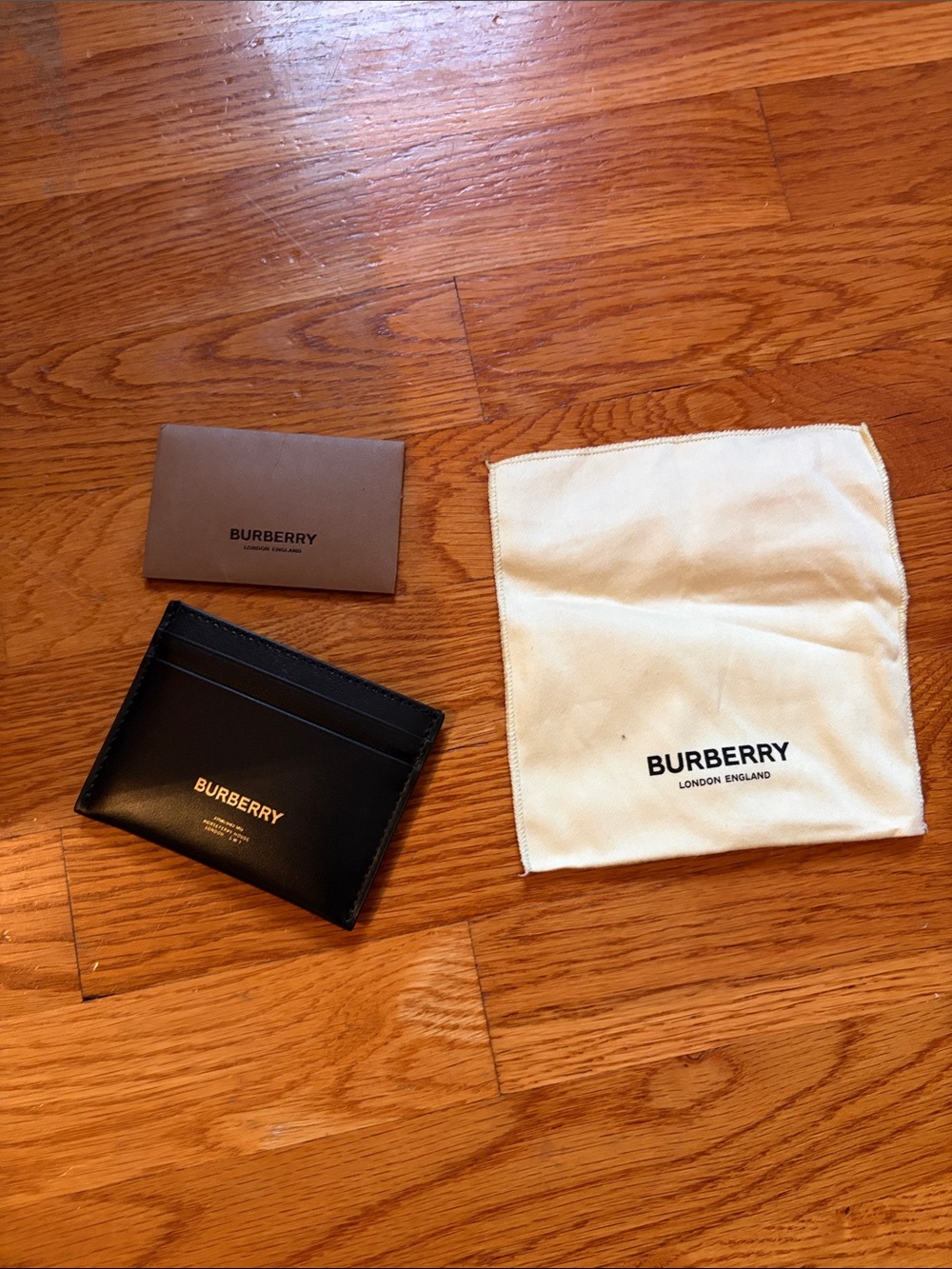 Never used! Brand New! Burberry Black Leather Card & Key Sleeve with Gold Logo